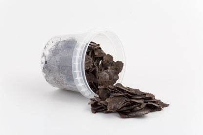 Freeze-dried Tuber melanosporum slices spilling from a clear container2